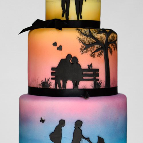 Air brush wedding cake with silhouette people through their life journey